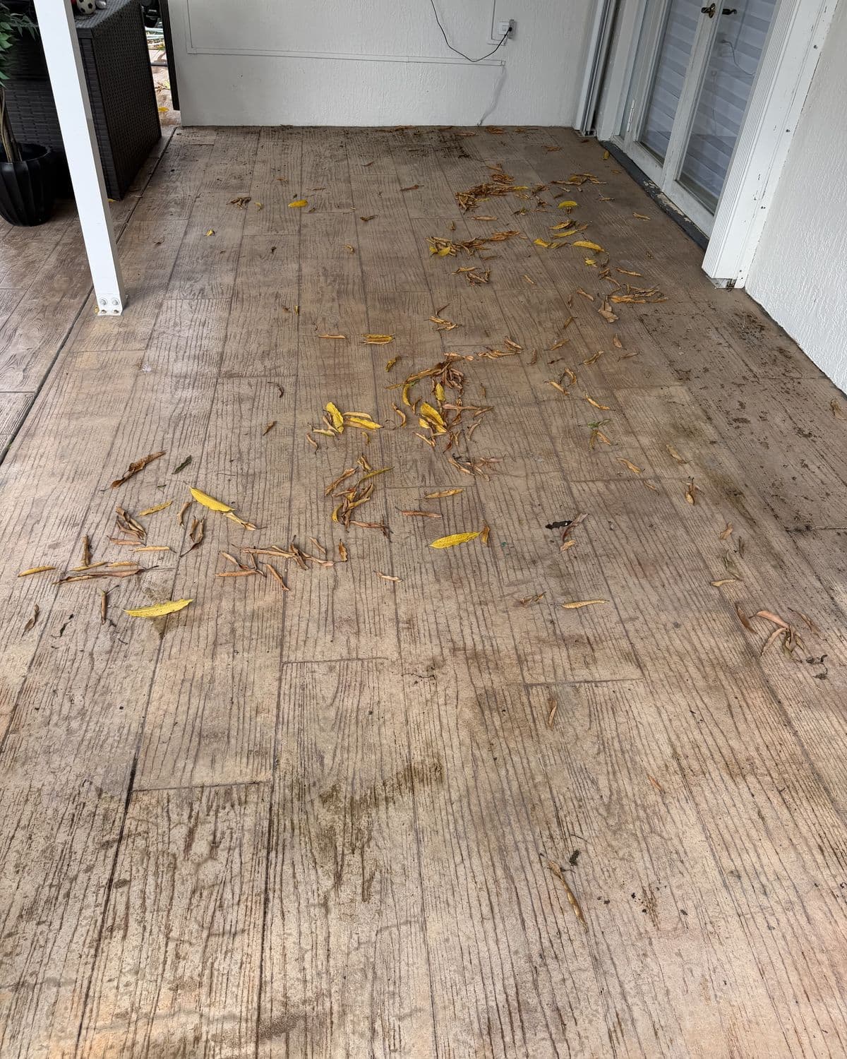 Stamped concrete patio in South Florida — before cleaning